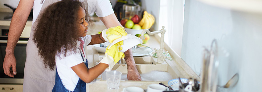 young girl doing dishes